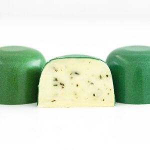 Picture of beautiful white chocolate and butter ganache mixed with fresh chopped rosemary herbs with coarse sea salt inside emerald green colored crisp chocolate shells