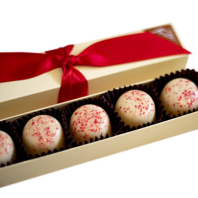 5 piece box of seasonal peppermint truffles with red ribbon