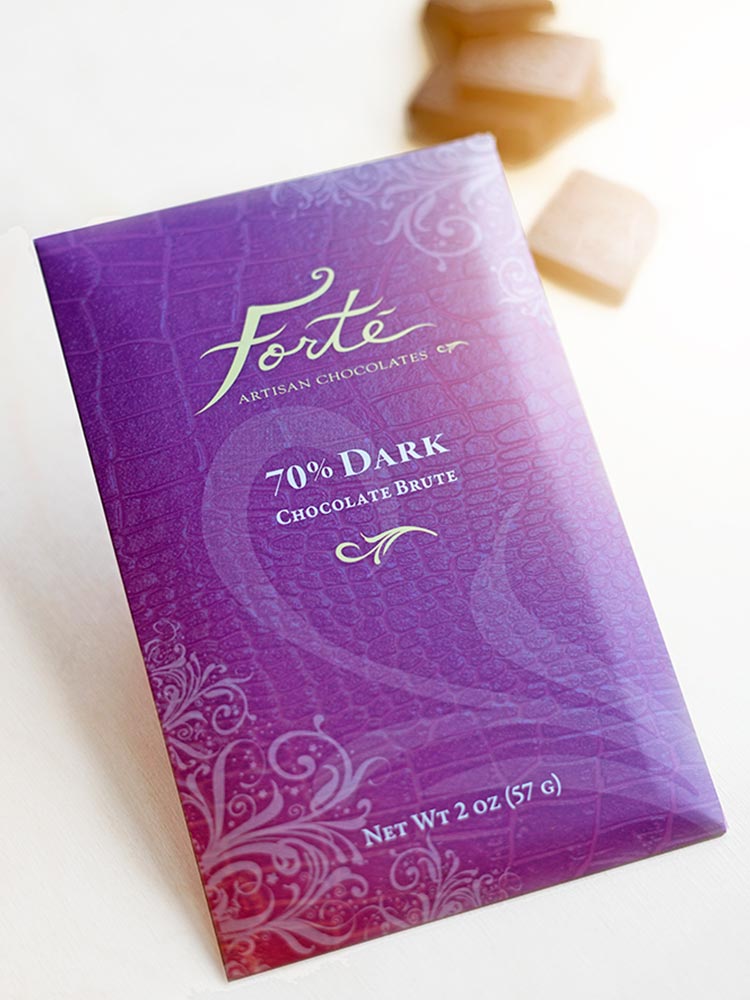 Forte 70% dark chocolate bar packaging in bright purple with chocolate squares in background