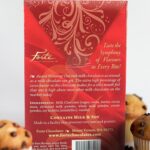 Back of Milk Love bar standing among 3 chocolate chip muffins