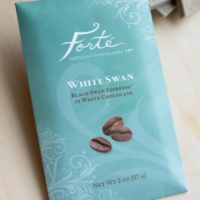 White swan espresso bar packaging with blocks of bar broken up in fore and background