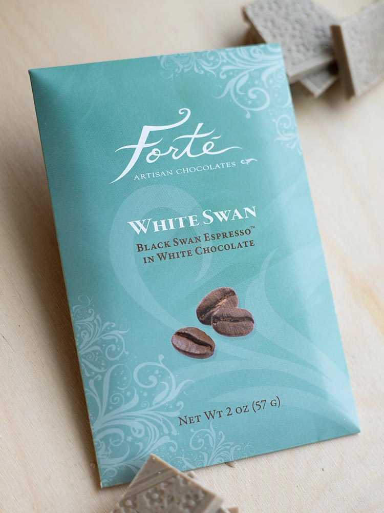 White swan espresso bar packaging with blocks of bar broken up in fore and background