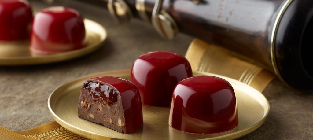 Tart cherry award winning truffles. Luxurious dark chocolate truffles, meticulously handcrafted by renowned chocolatier in America, exuding opulence and elegance. These truffles, celebrated as the pinnacle of gourmet chocolates, embody the epitome of luxury and sophistication, perfect for discerning connoisseurs and executive gifting. Recognized as some of the world's best chocolates by a top chocolatier