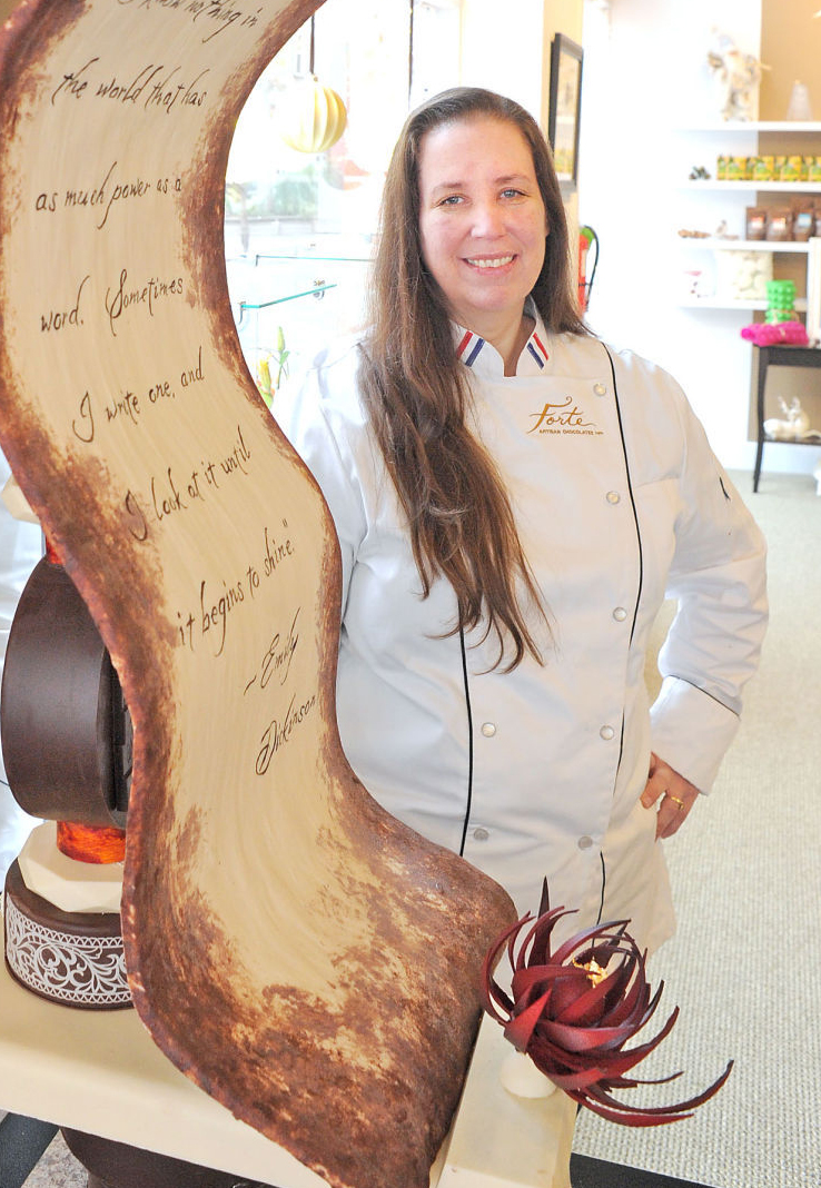 Chef Karen by Chocolate Sculpture that is taller then she is